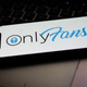 A phone displaying the OnlyFans logo